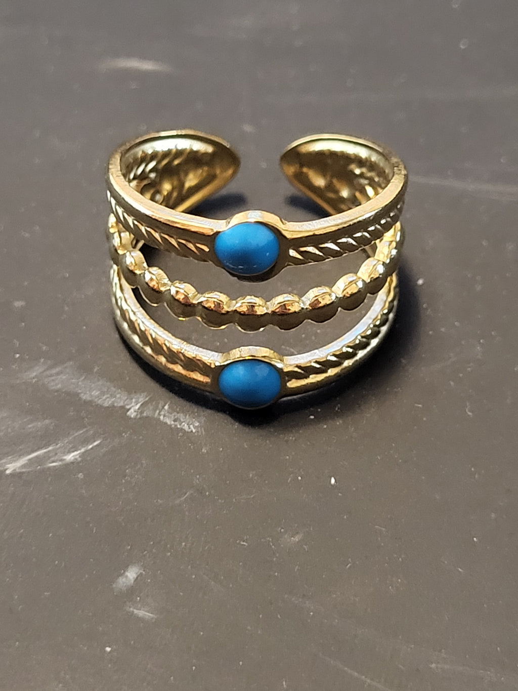 Bague ajustable acier inoxydable doré triple anneaux pierres bleues