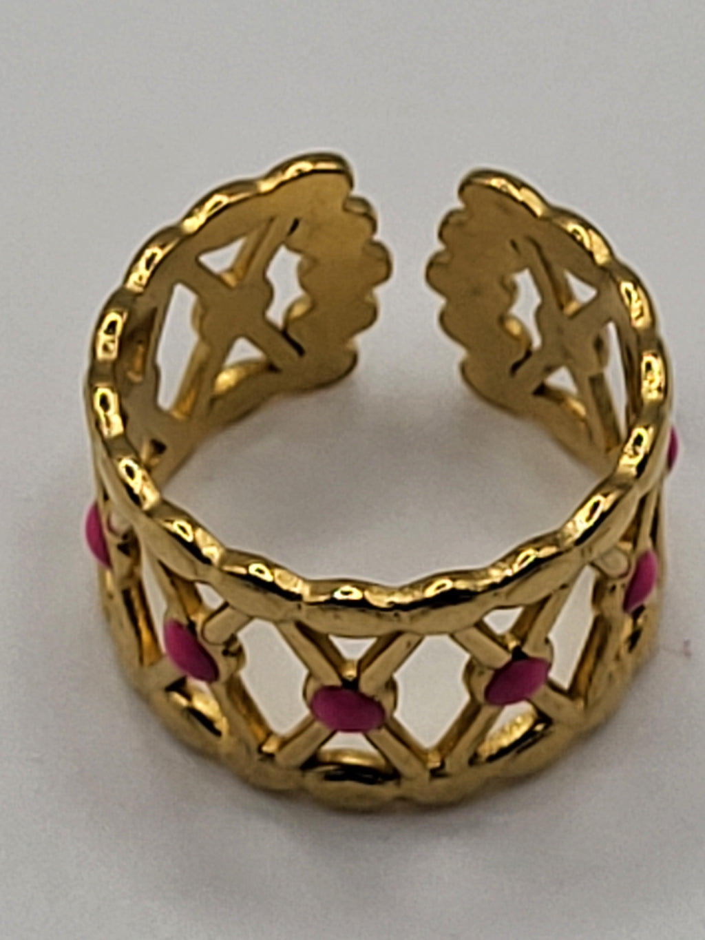 Bague acier inoxydable doré croisillons points roses