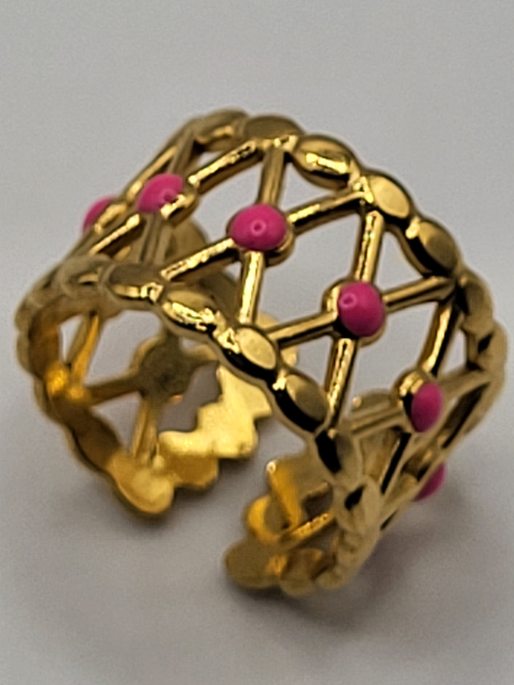 Bague acier inoxydable doré croisillons points roses