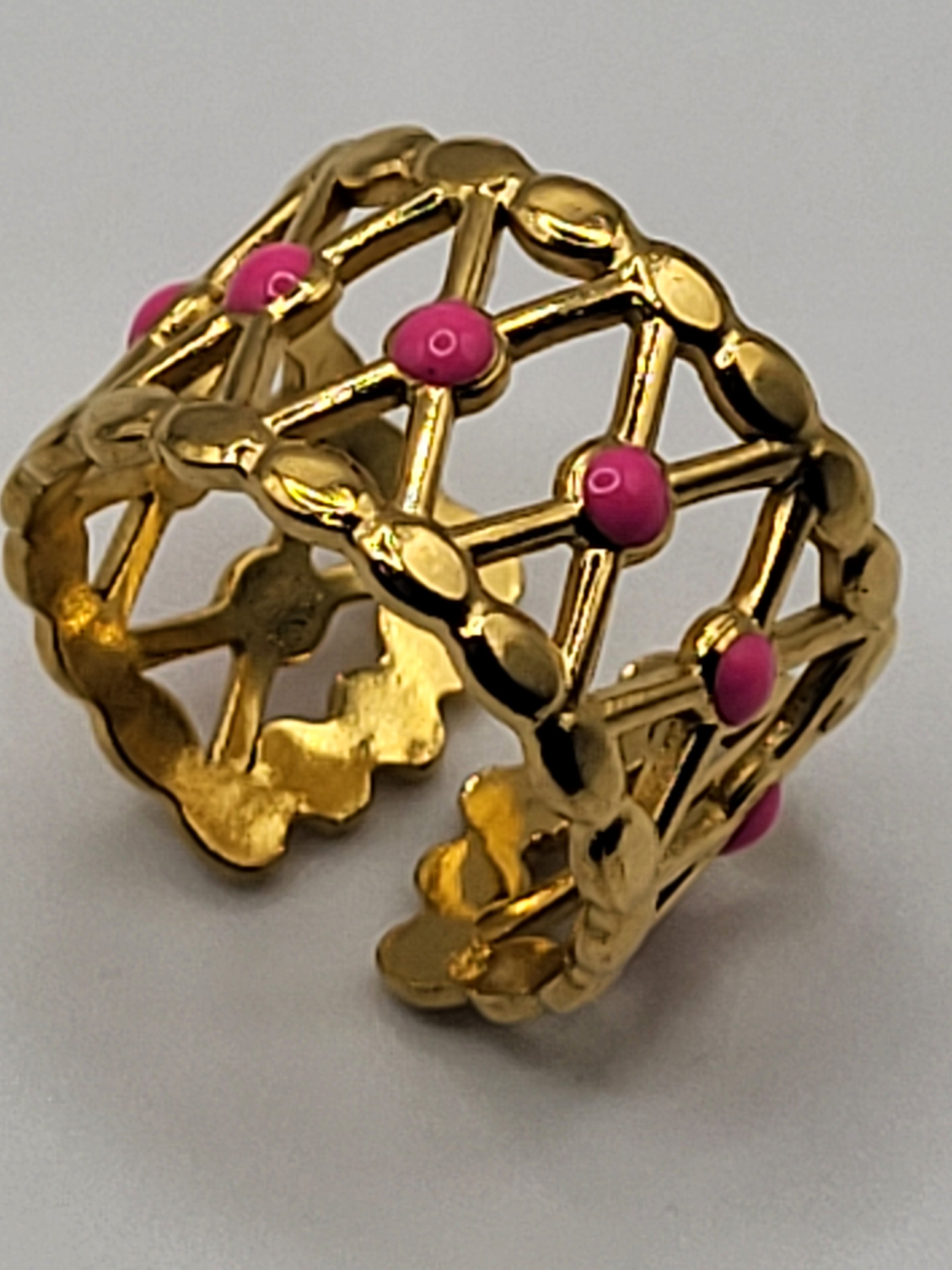 Bague acier inoxydable doré croisillons points roses