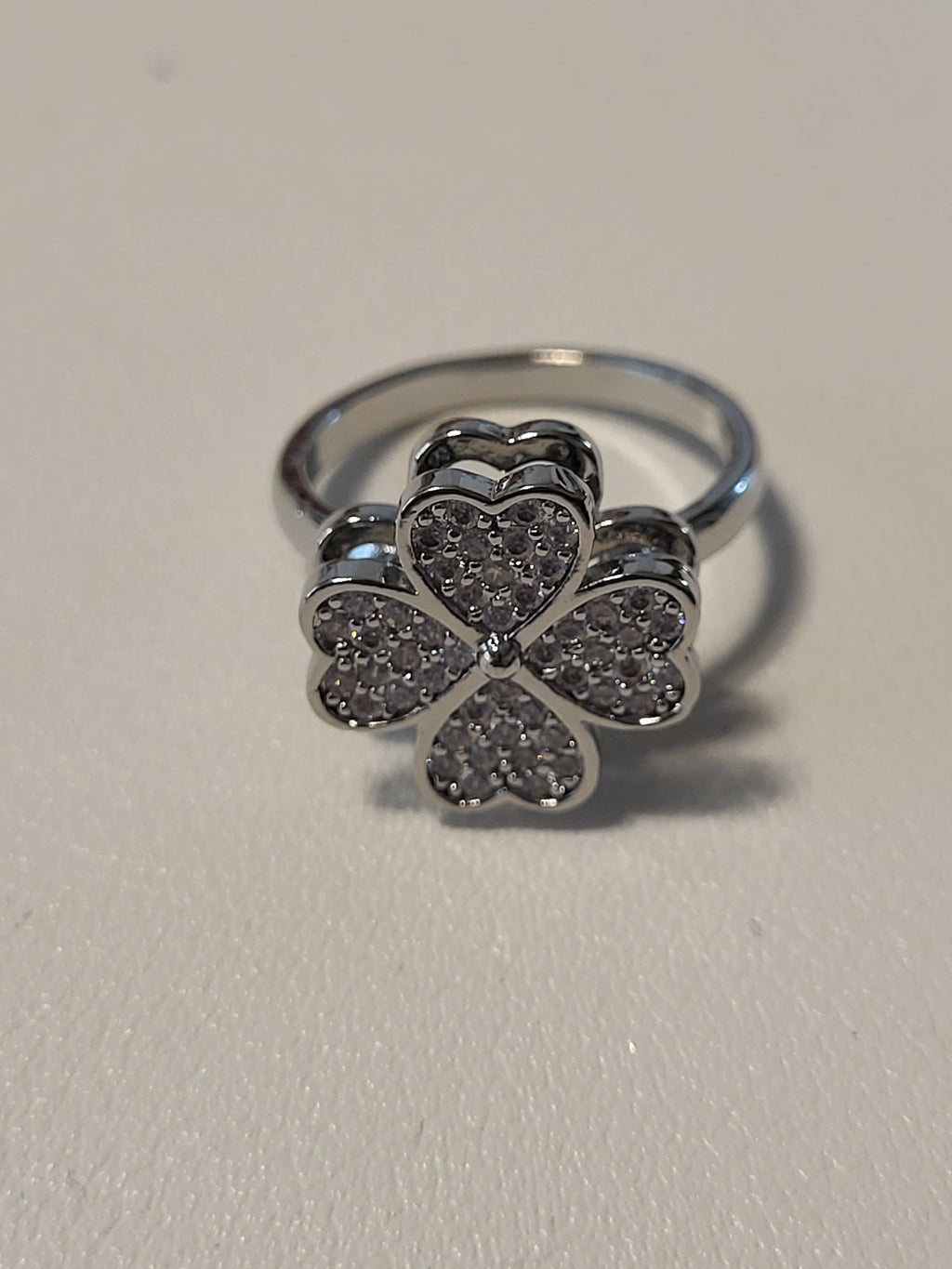 Bague acier inoxydable argentée ouverte fleur zircon anti-stress - la fleur tourne