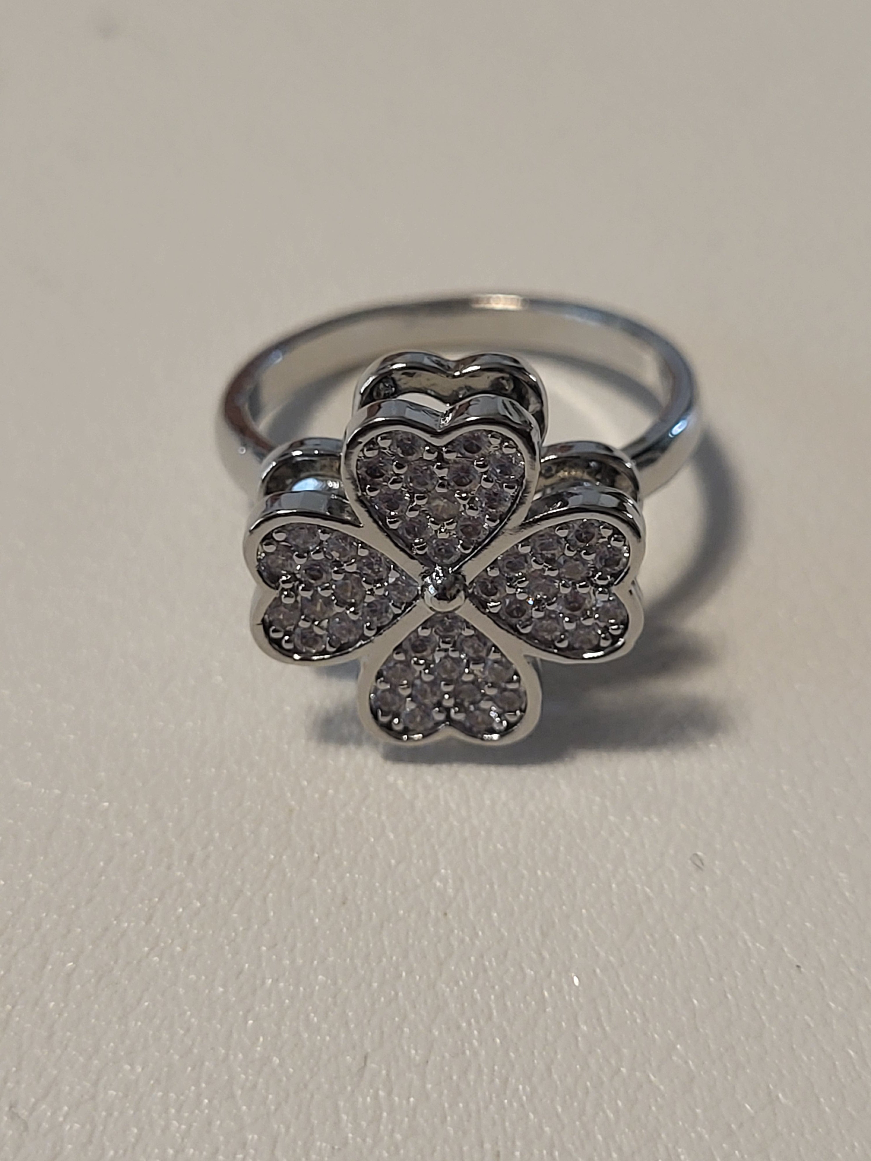 Bague acier inoxydable argentée ouverte fleur zircon anti-stress - la fleur tourne