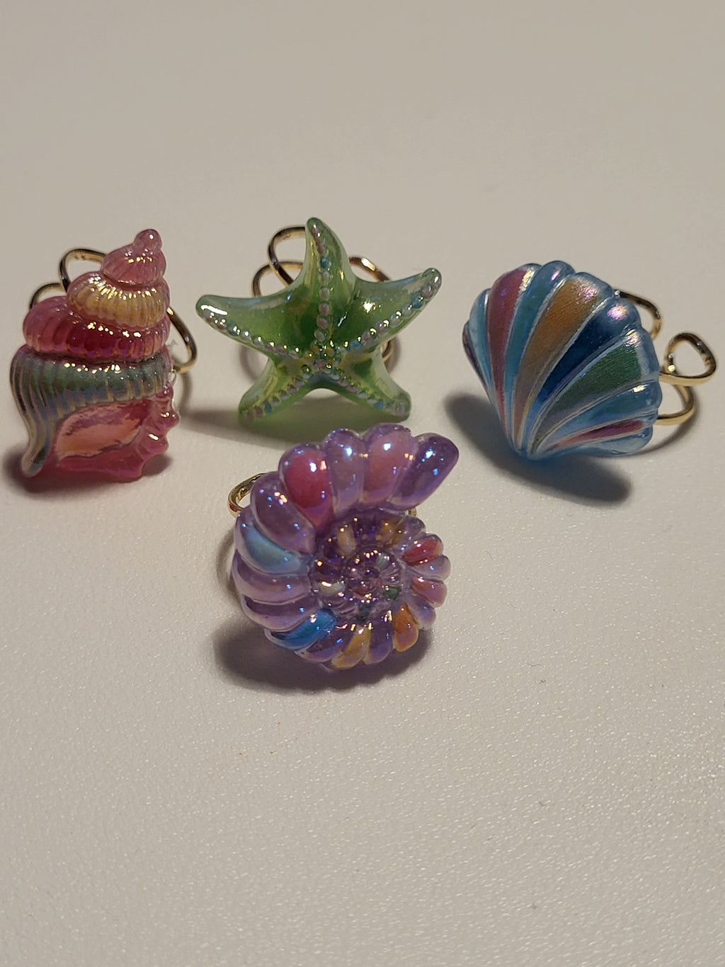 Lot de 4 bagues acryliques motif plage et mer