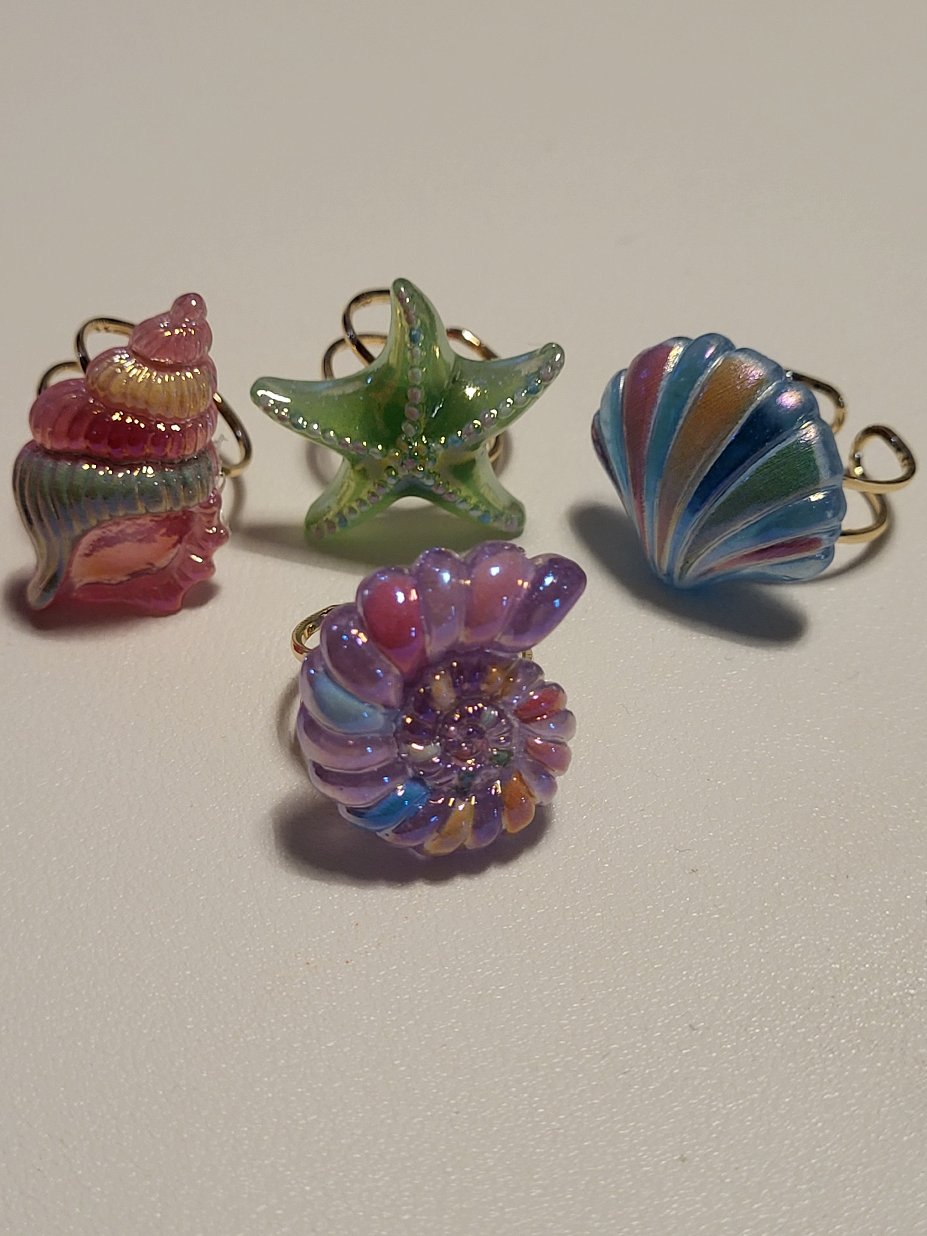 Lot de 4 bagues acryliques motif plage et mer