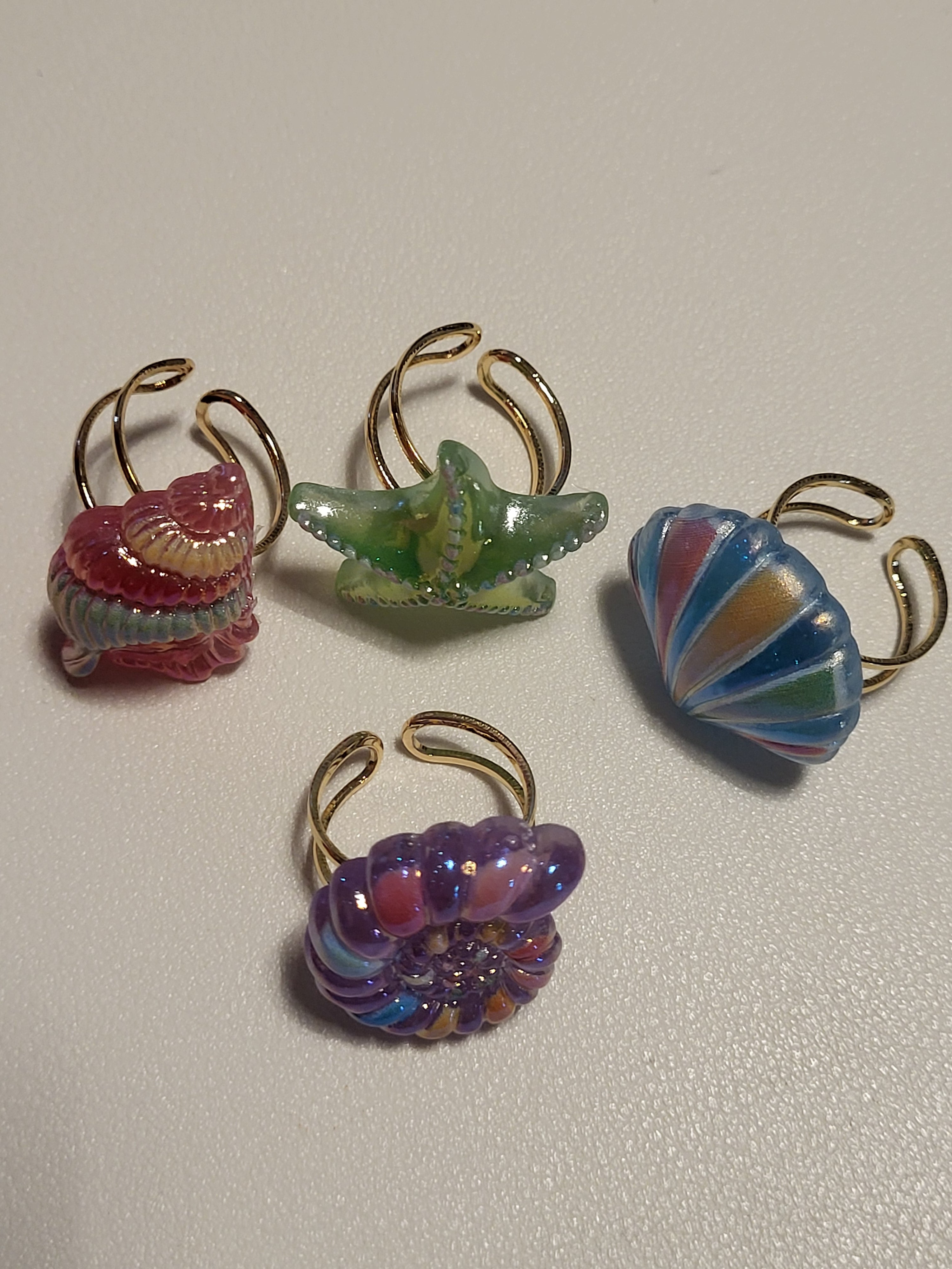 Lot de 4 bagues acryliques motif plage et mer