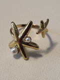 Bague dorée ouverte à l'avant à 2 étoiles de mer avec perles