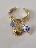 Bague dorée ajustable pendentif soleil et porcelaine bleue