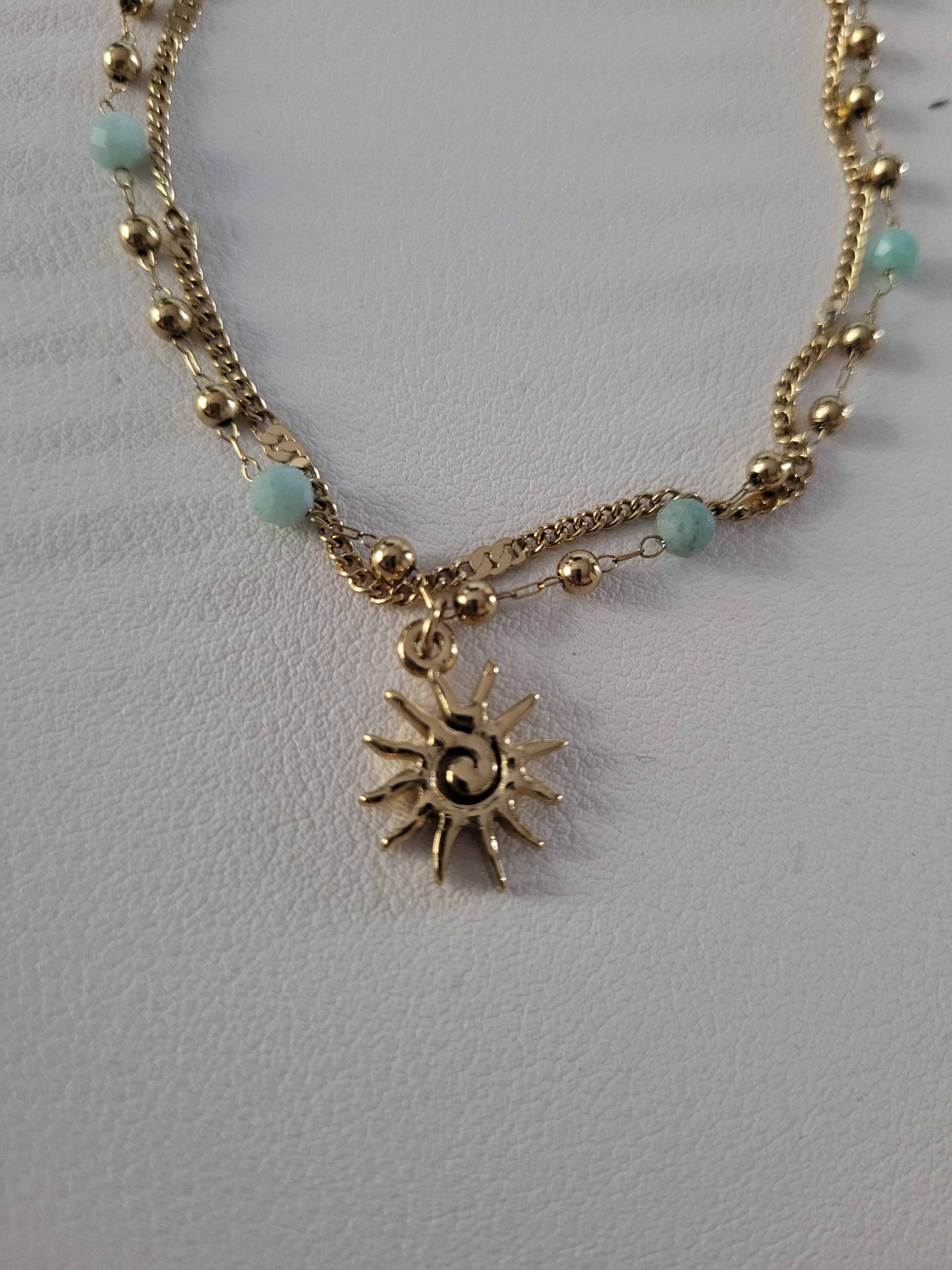 Chaîne de cheville dorée double rang soleil et perles bleu