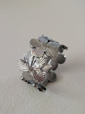 Bague ouverte acier inoxydable motif fleurs large argenté
