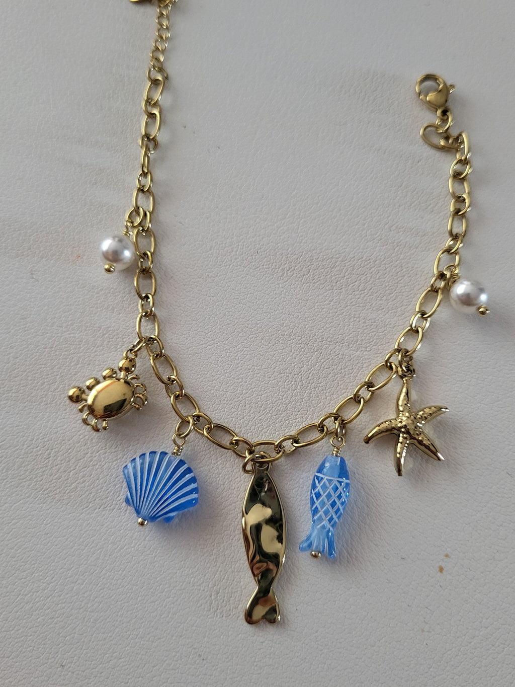 Bracelet doré charms marins bleus et crabe en strass