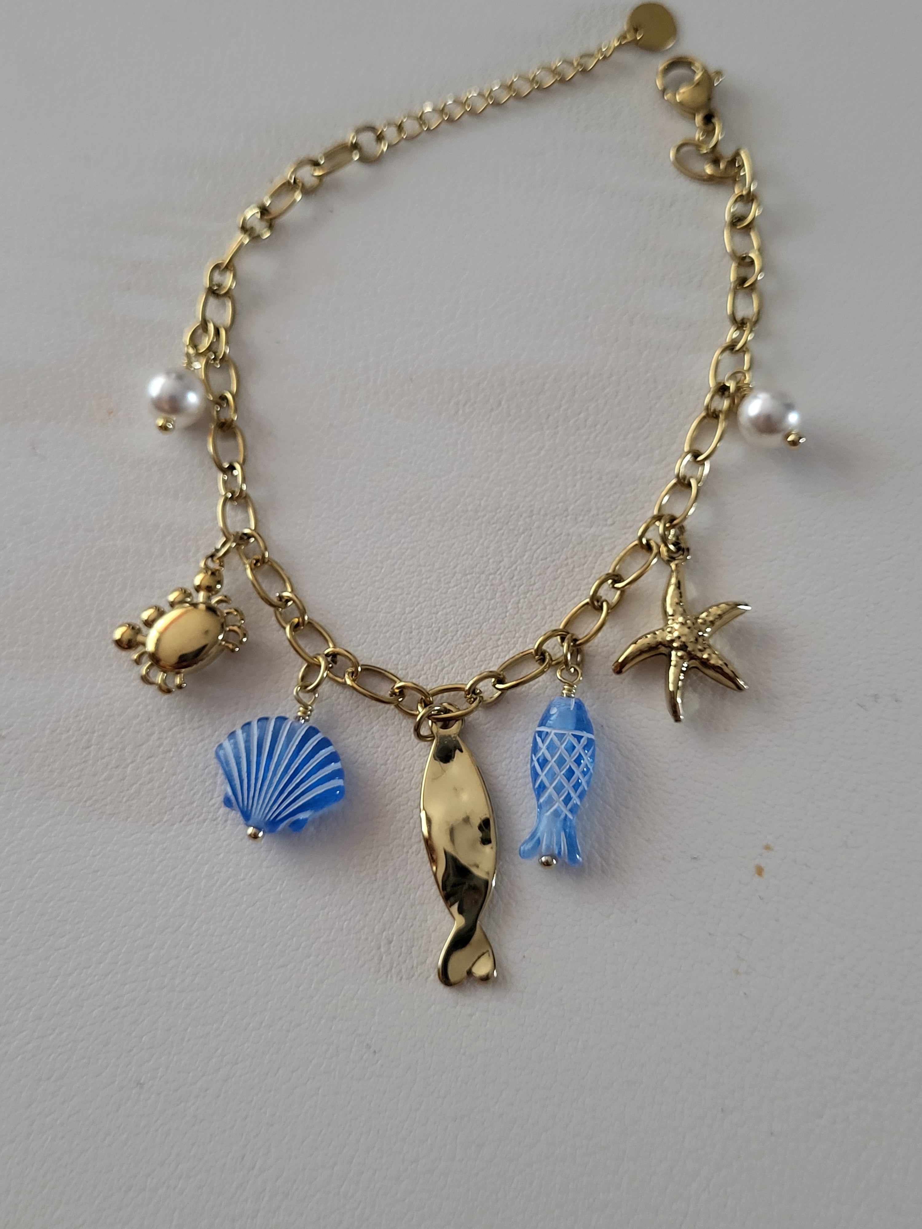 Bracelet doré charms marins bleus et crabe en strass