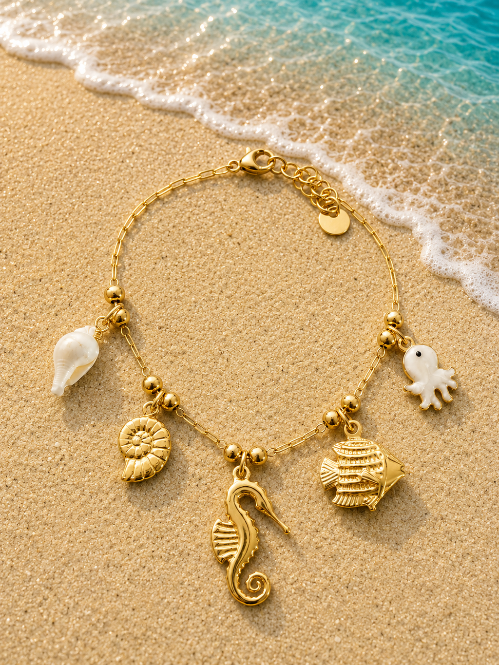 Bracciale con charms ippocampo e polpo perlato dorato