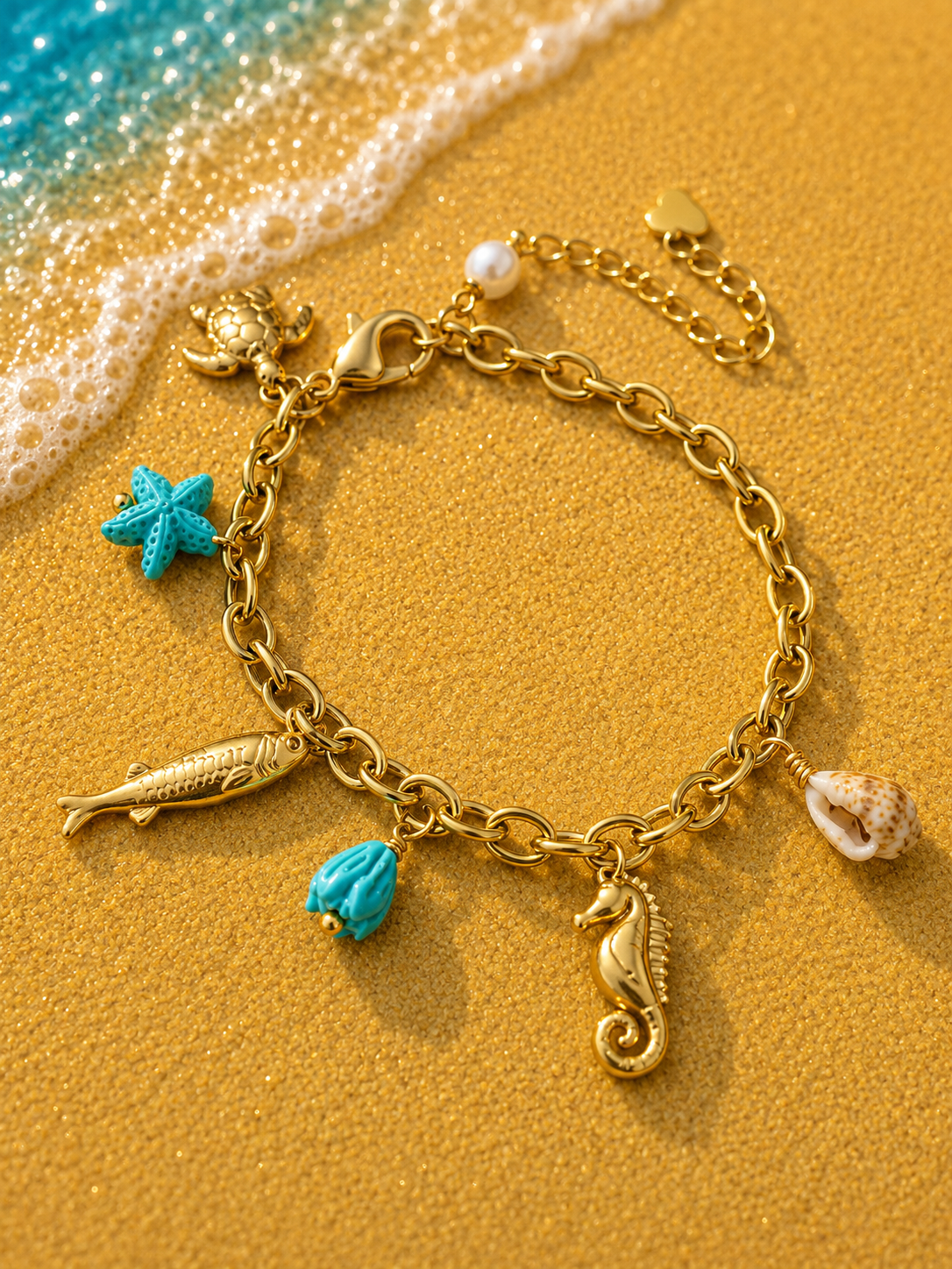 Bracciale dorato con ciondoli animali marini e stella marina blu