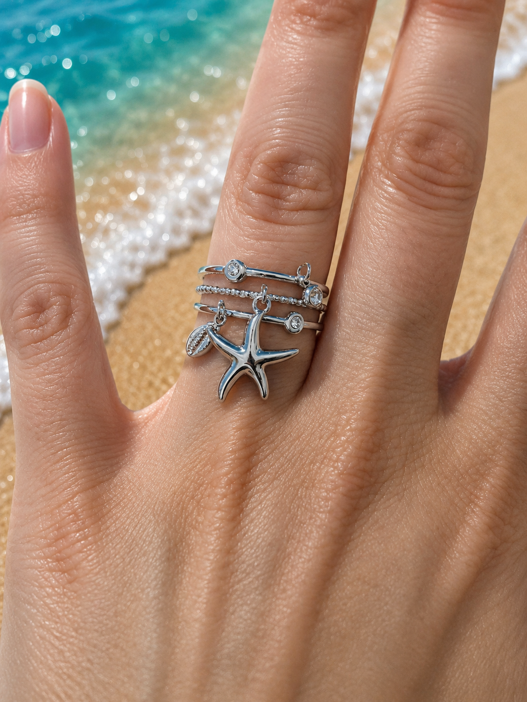 Anello aperto a triplo cerchio con stella marina e strass argentati