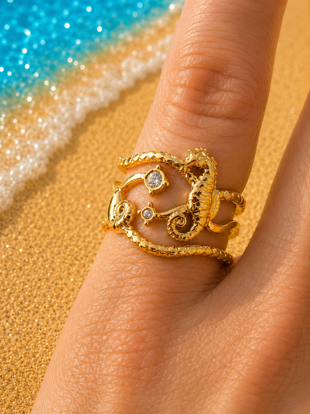 Anello regolabile ippocampo e stelle marine dorato