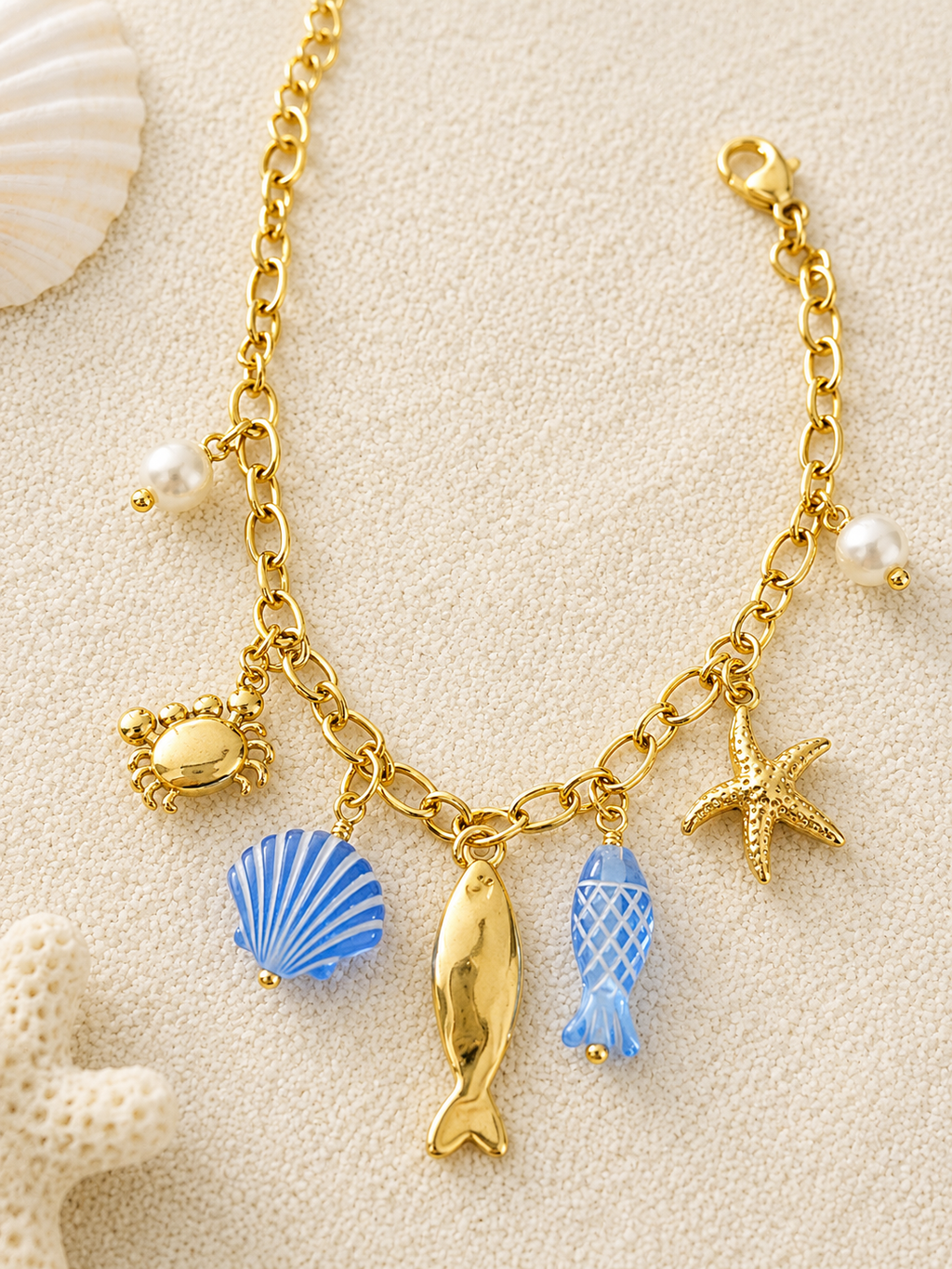Bracelet doré charms marins bleus et crabe en strass