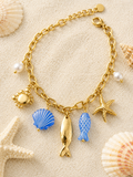 Bracelet doré charms marins bleus et crabe en strass