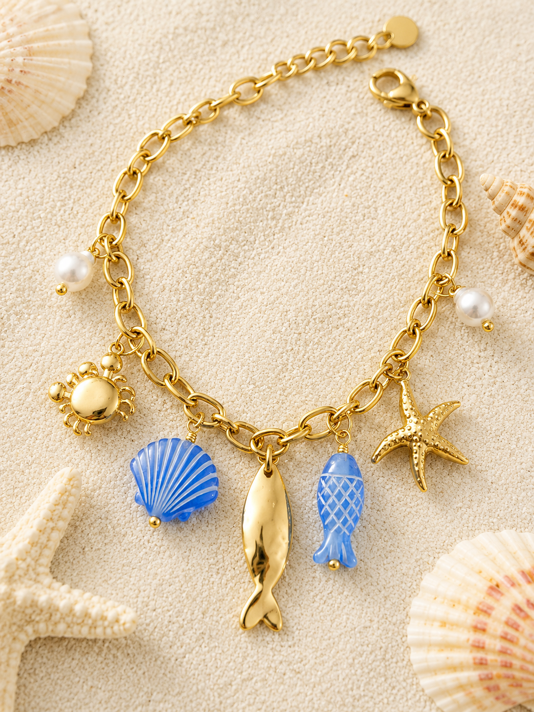 Bracelet doré charms marins bleus et crabe en strass