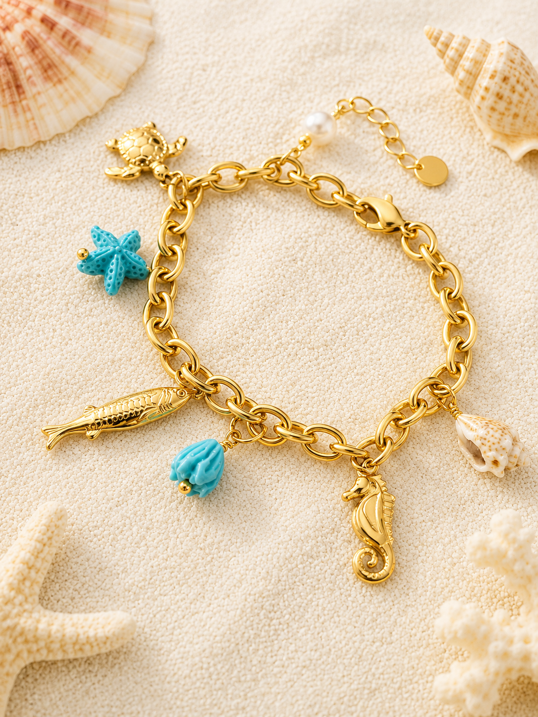 Bracelet doré charms animaux marins et étoile de mer bleu