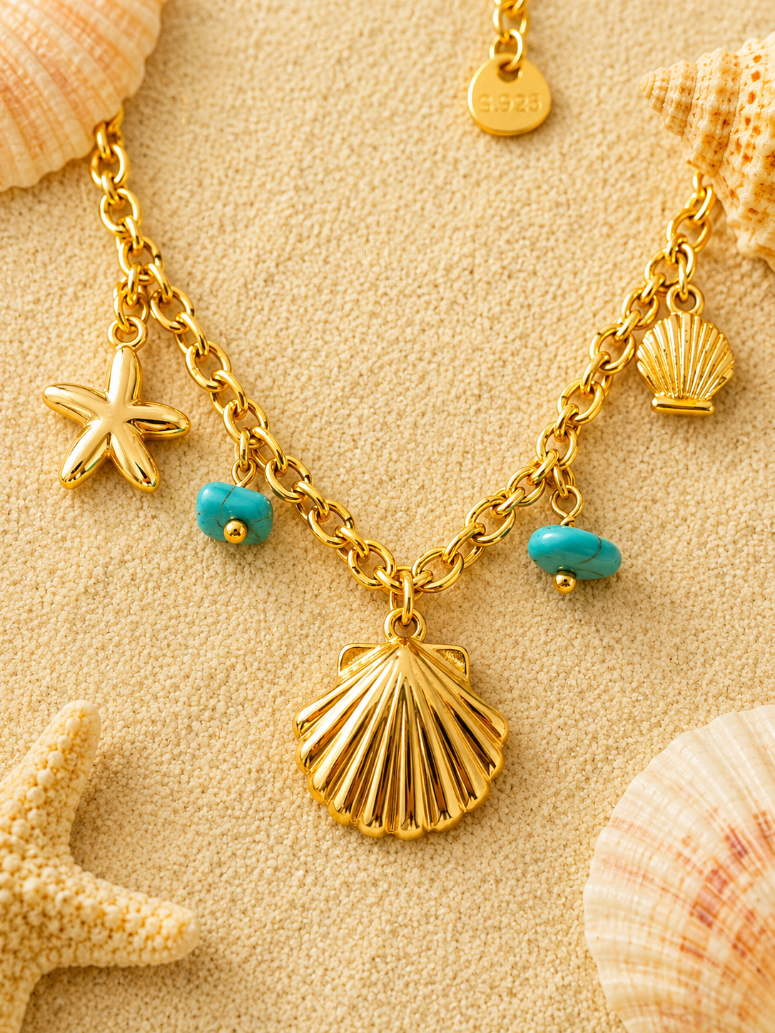 Chaîne de cheville dorée à pierres turquoises et charms marins