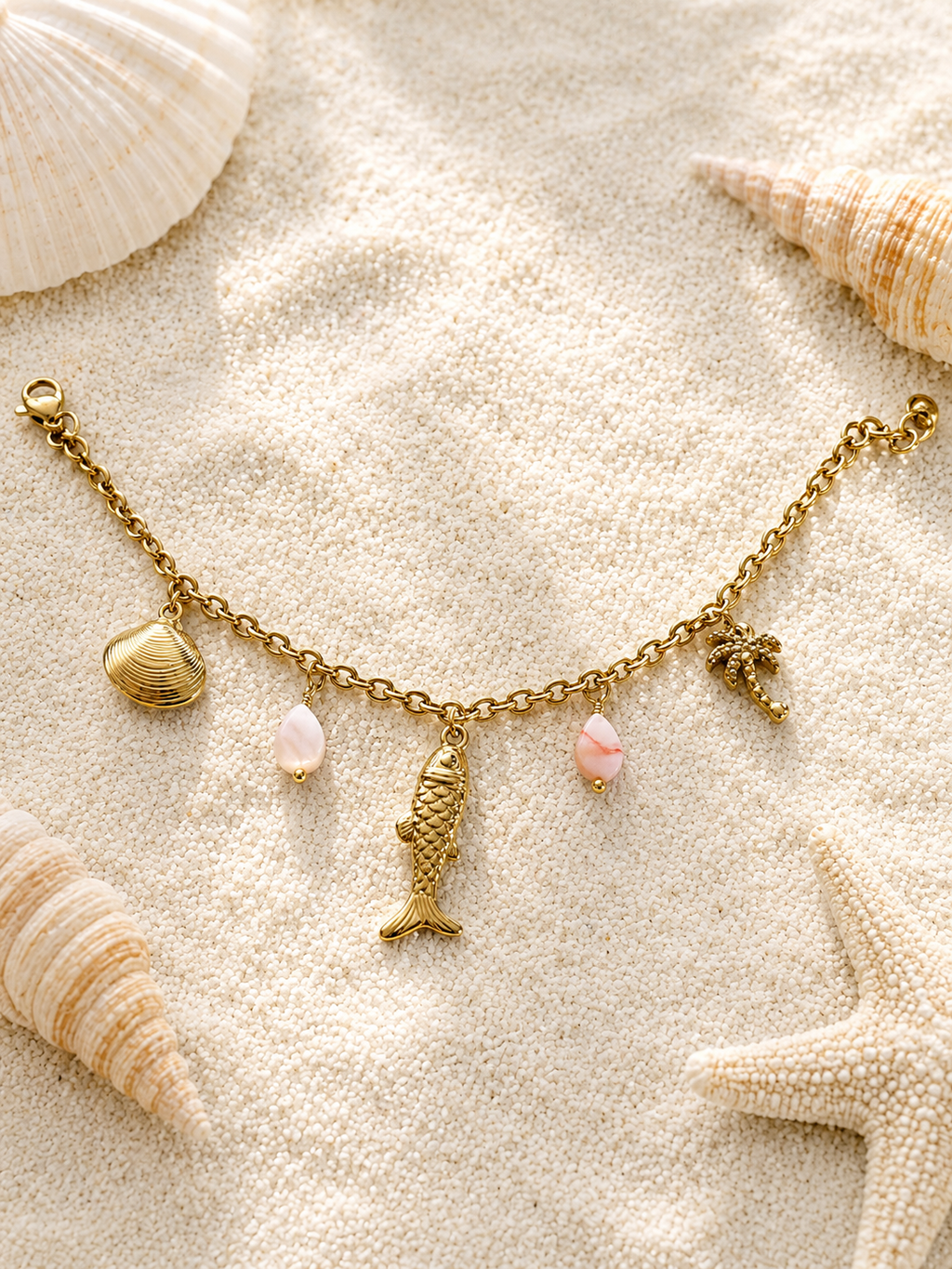 Bracelet doré charms marins palmier et pierres roses