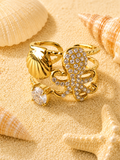 Bague ajustable poulpe strassé et coquillage doré