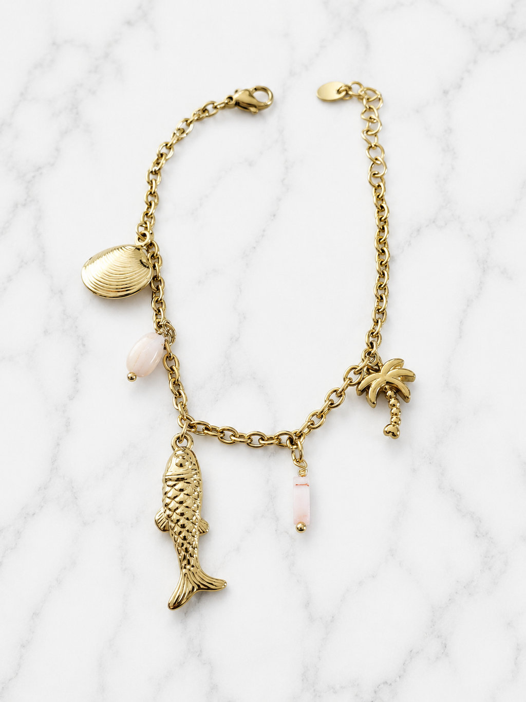 Bracelet doré charms marins palmier et pierres roses