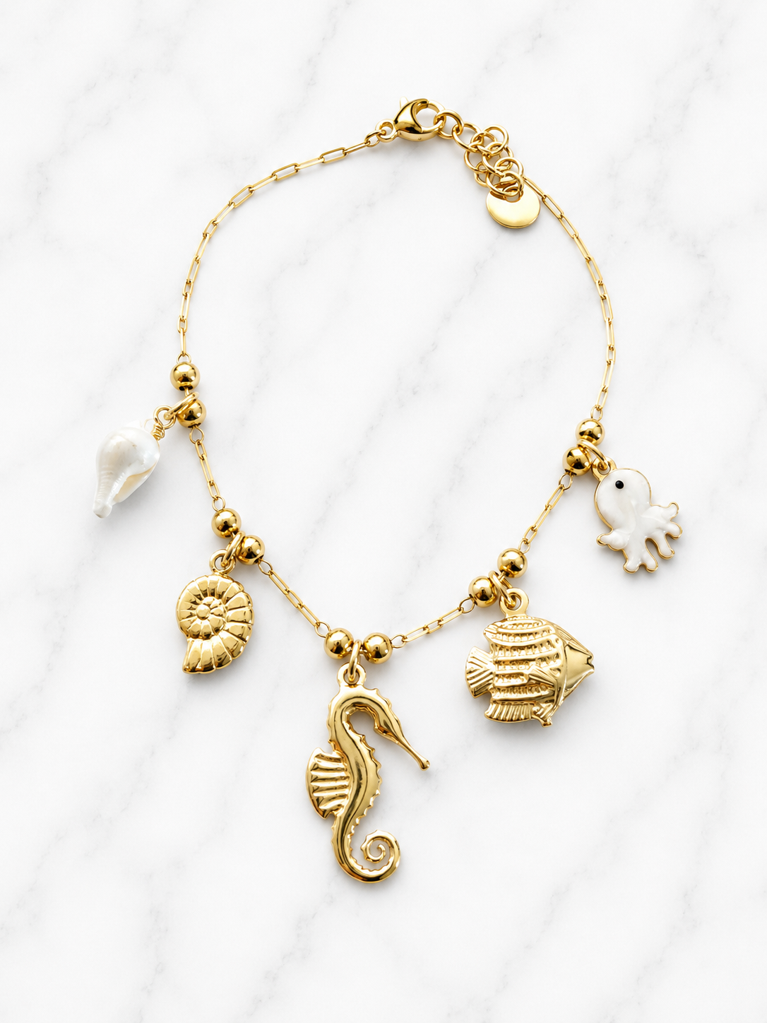 Bracciale con charms ippocampo e polpo perlato dorato