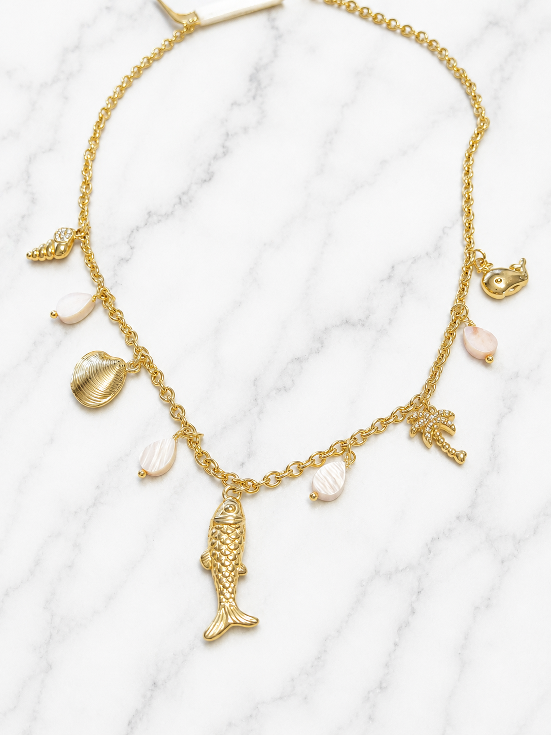 Collana dorata charms marini con palma e pietre rosa