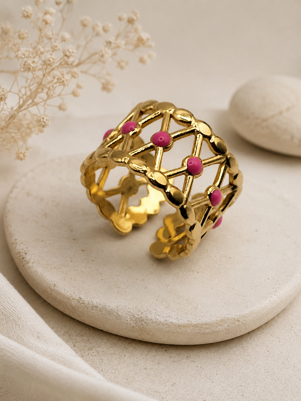 Bague acier inoxydable doré croisillons points roses