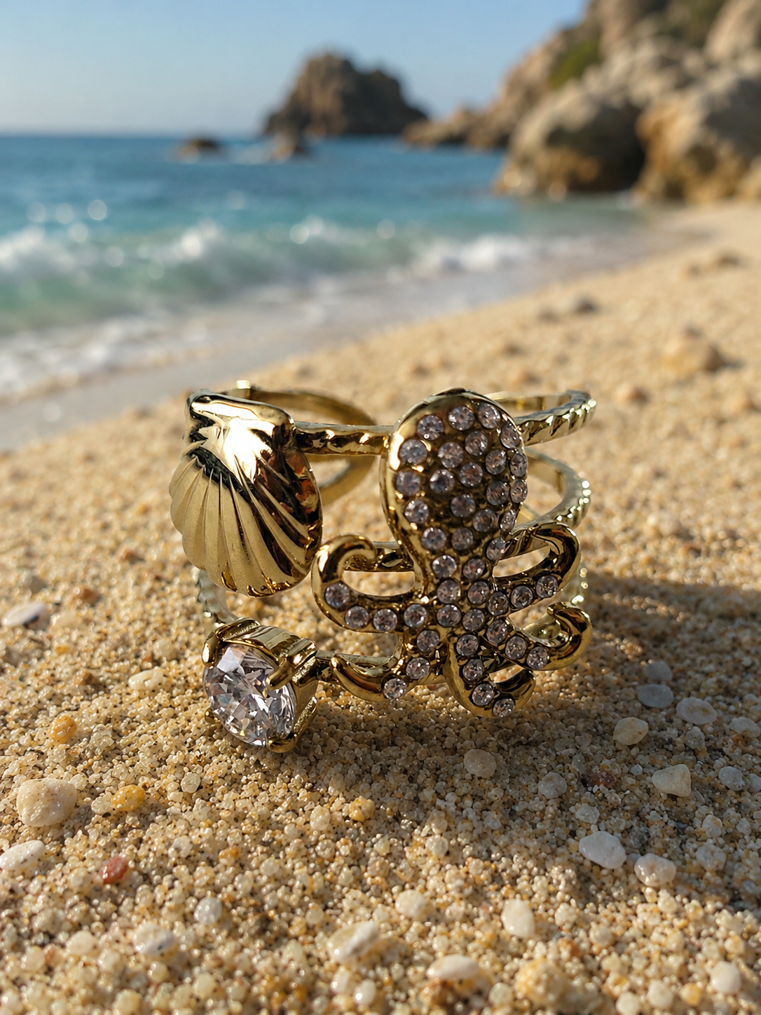 Bague ajustable poulpe strassé et coquillage doré