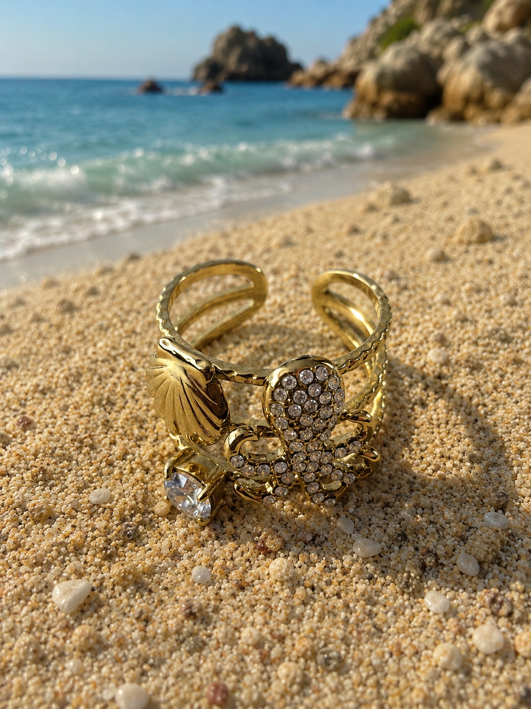Bague ajustable poulpe strassé et coquillage doré
